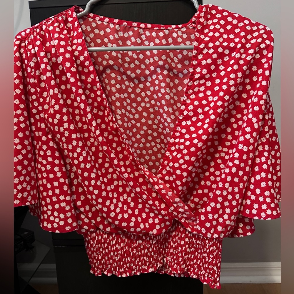 Red and white flowery blouse.